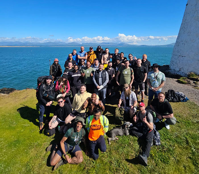 Mandem Meetup guys resting while cliff walking